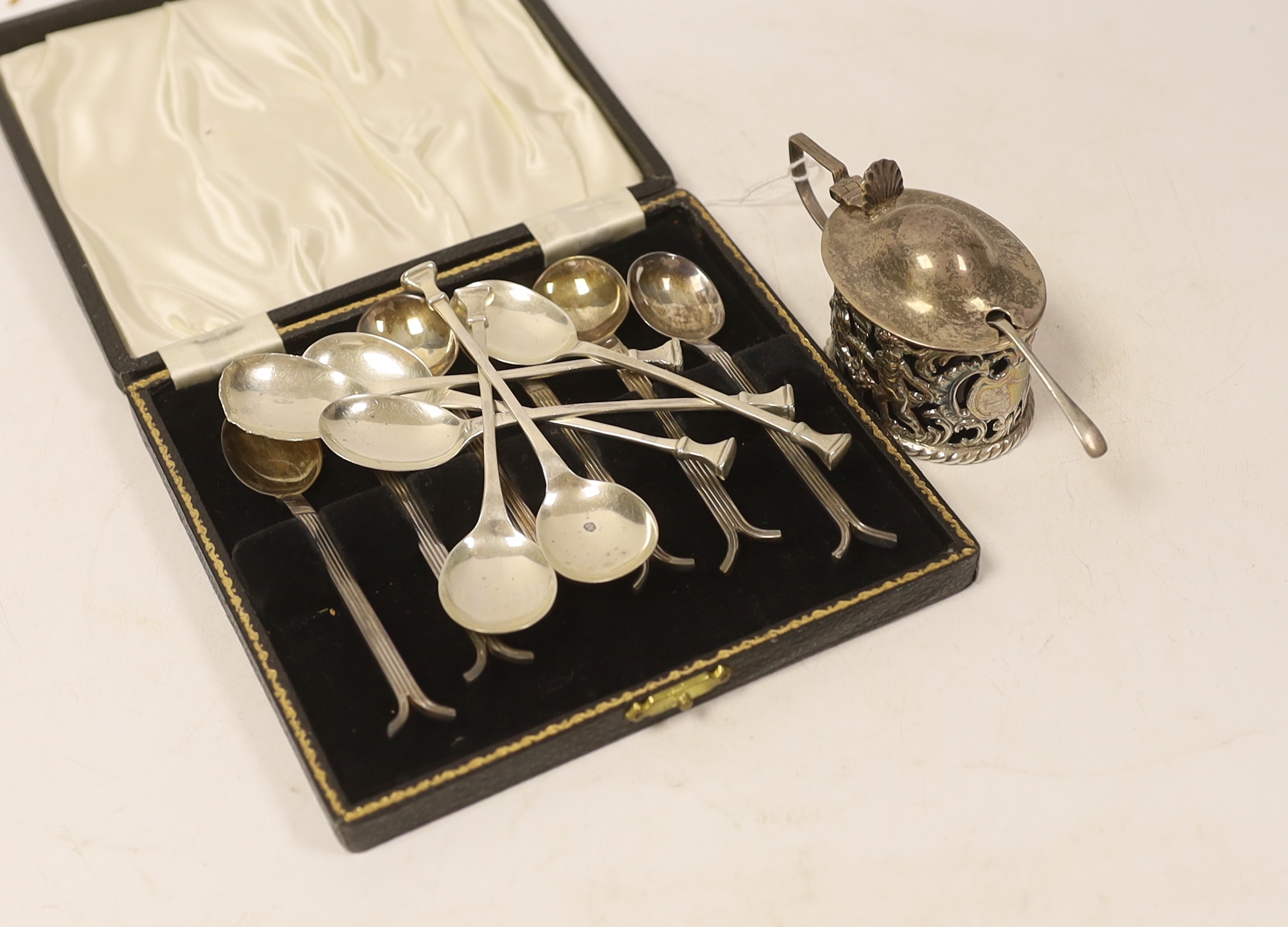 A cased set of six silver George VI silver teaspoons, with reeded stems and split terminals, Sheffield, 1946, one other set of six silver teaspoons (one spoon a.f.) and a pierced silver mustard pot.